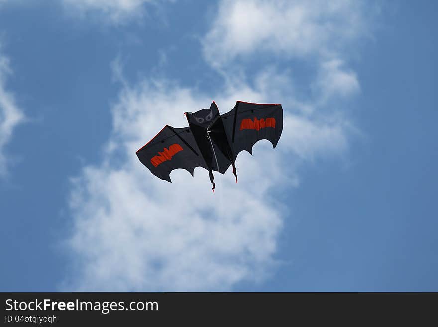 Kite in the sky in the form of a bat