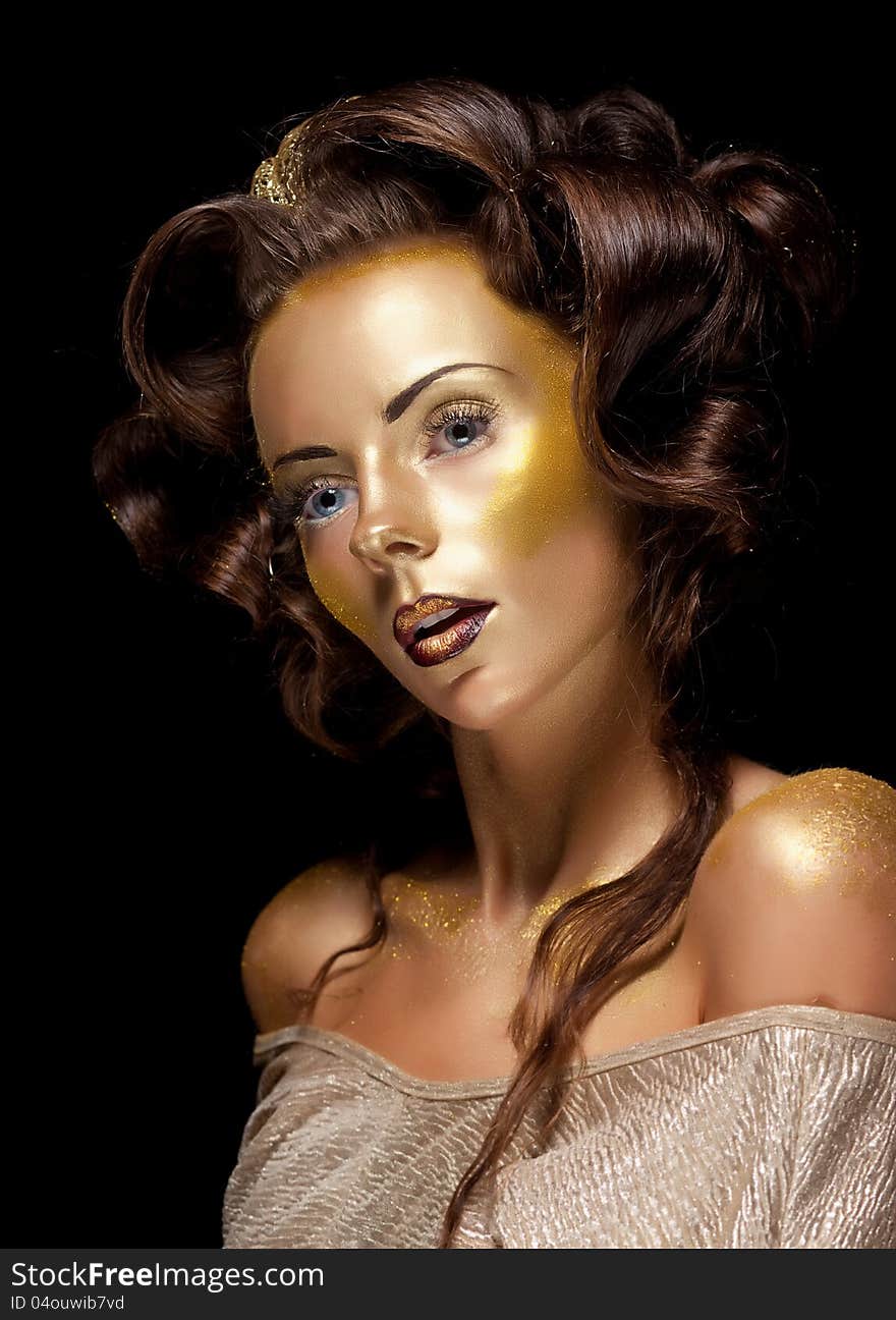 Fashion style. Art. Waxen gold gilt woman face - glamour luxury makeup. Fashion style. Art. Waxen gold gilt woman face - glamour luxury makeup