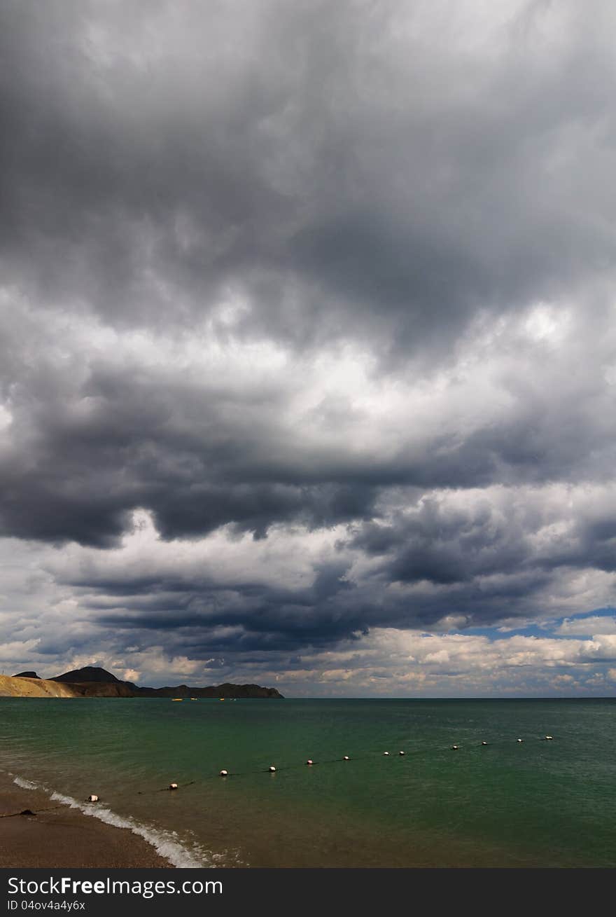 View of thunderstorm clouds above the sea. View of thunderstorm clouds above the sea