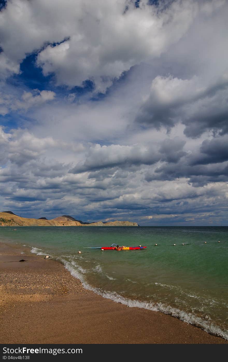 View of thunderstorm clouds above the sea. View of thunderstorm clouds above the sea