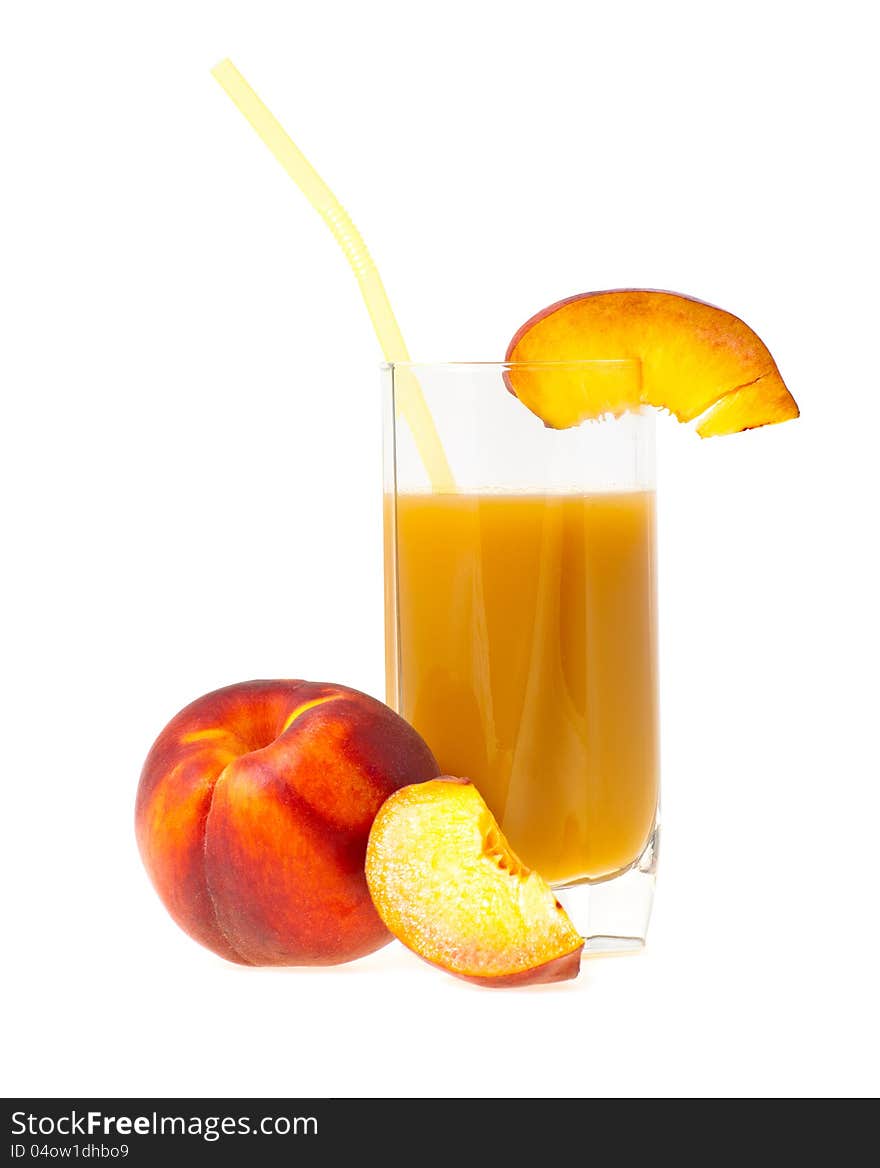 Peach juice in a glass nearby a peach from shares