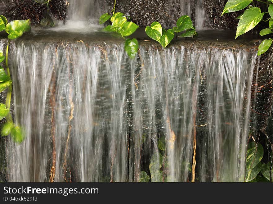 Waterfall in Japanese style garden. Waterfall in Japanese style garden.