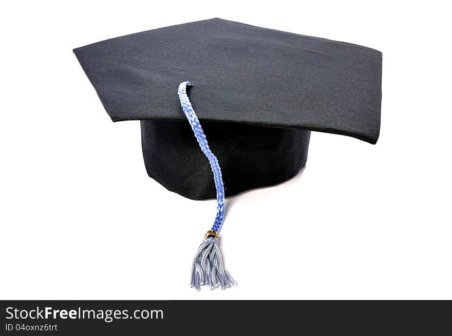 Graduation cap with blue tassel isolated over white background