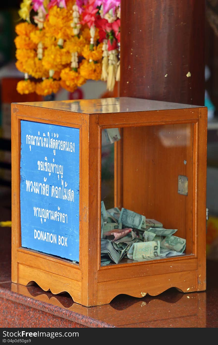 Donation Box with Thai Baht banknote