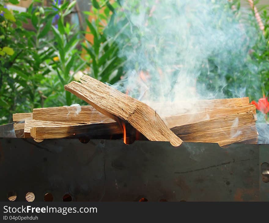 Burning wood in a brazier. Burning wood in a brazier