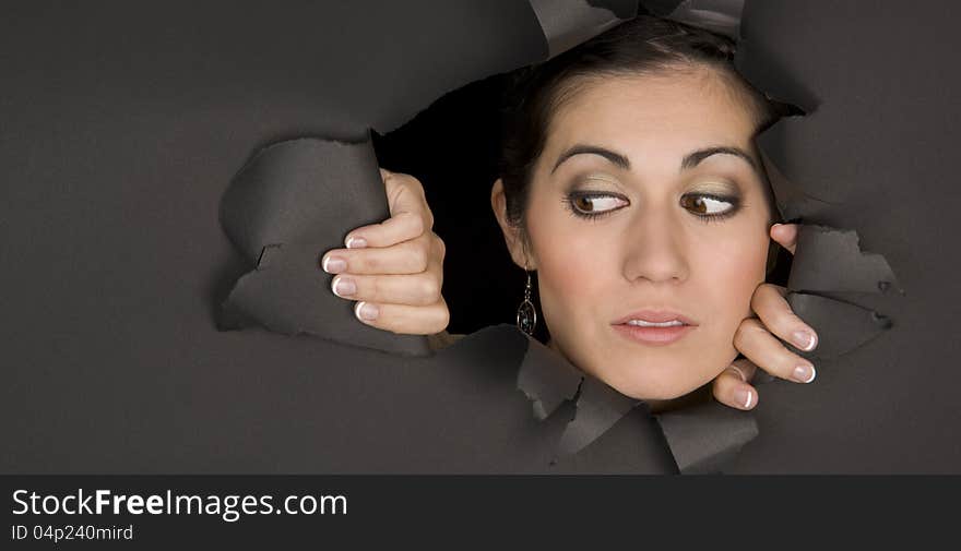 Woman Peeking In Through Torn Hole