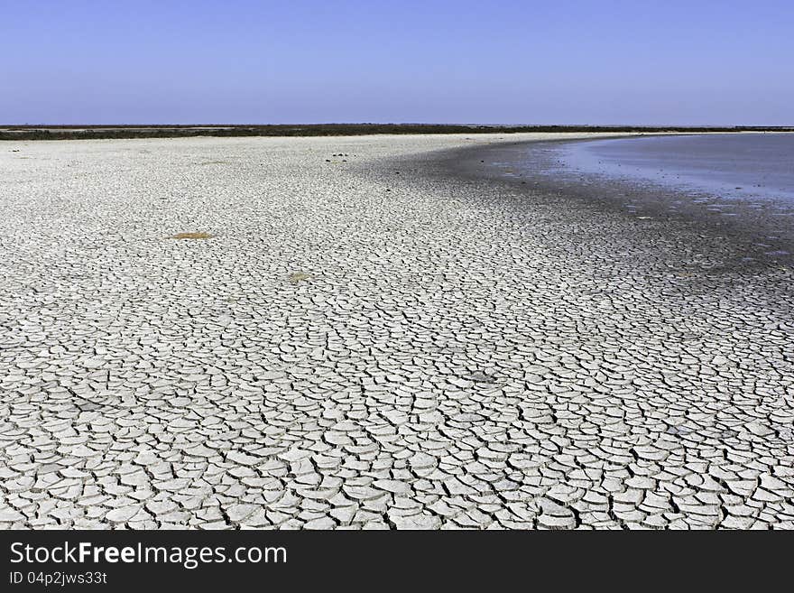 Dried cracked earth near the Mediterranean Sea at Marseilles, France. Dried cracked earth near the Mediterranean Sea at Marseilles, France.