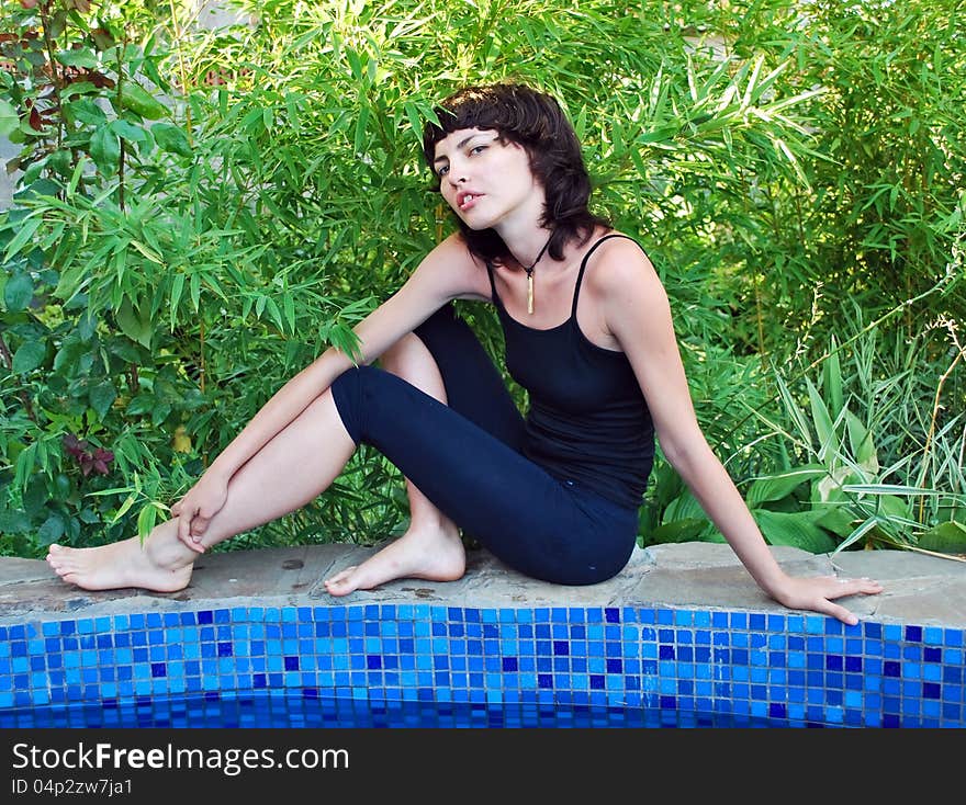 Beautiful girl against the backdrop of greenery. Beautiful girl against the backdrop of greenery