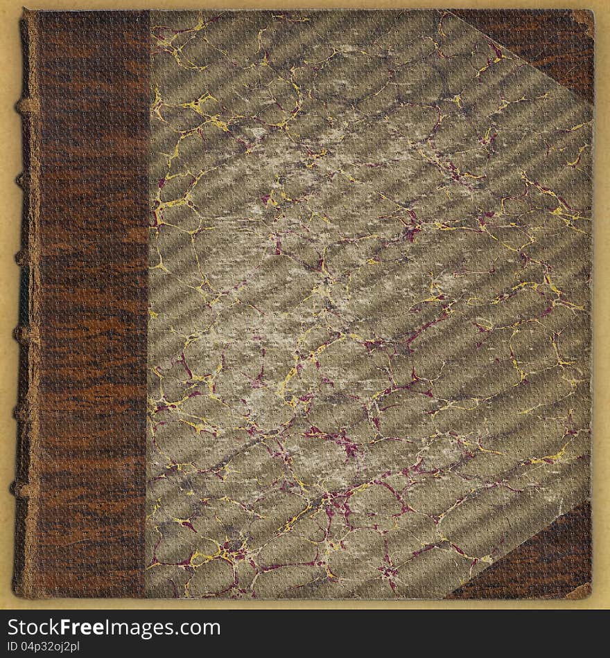 Vintage textured leatherbound book background with aged edges and worn marble design cover in burgundy, gold and grey. Vintage textured leatherbound book background with aged edges and worn marble design cover in burgundy, gold and grey.