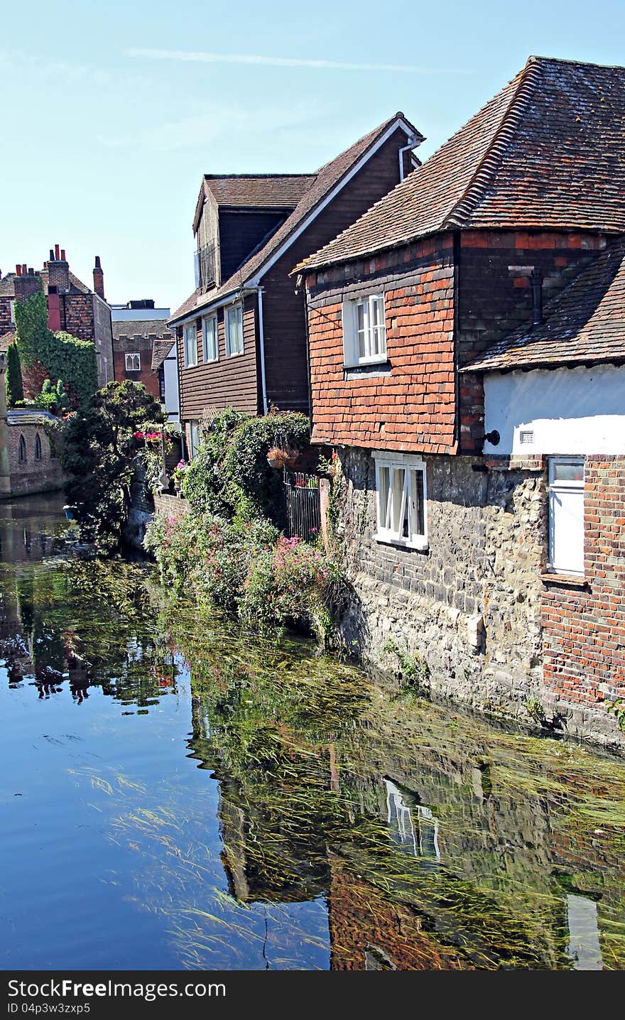 Picturesque photo of riverside cottages in the historic city of canterbury kent england.