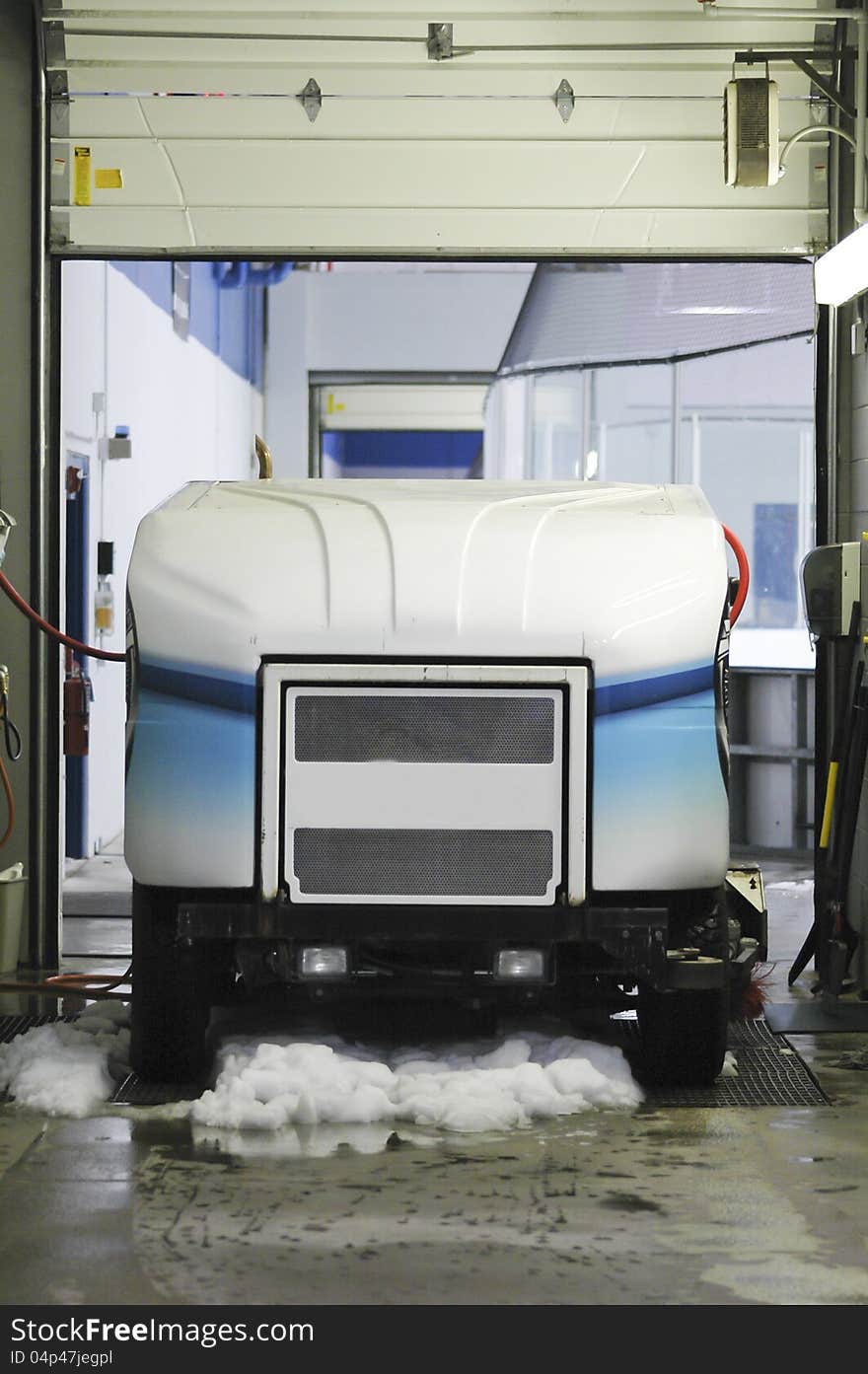 Ice resurfacing machine in garage