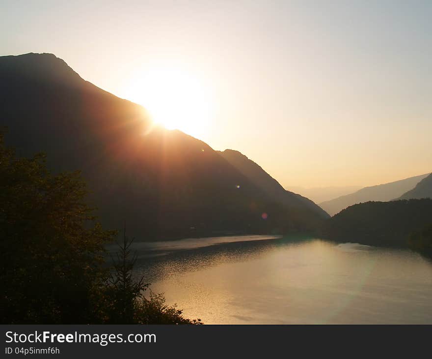 A view on a sunrise at Lago di Ledro, Italy. A view on a sunrise at Lago di Ledro, Italy