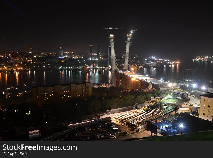 Night view of Vladivostok, panorama, construction of new bridge, Russia