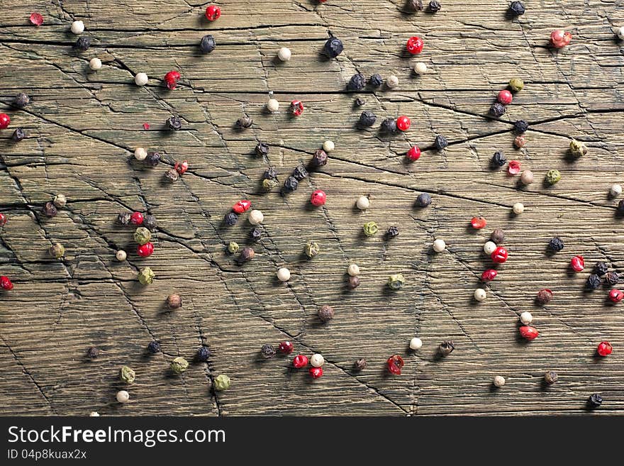 Peppercorn mix on vintage worn wood background