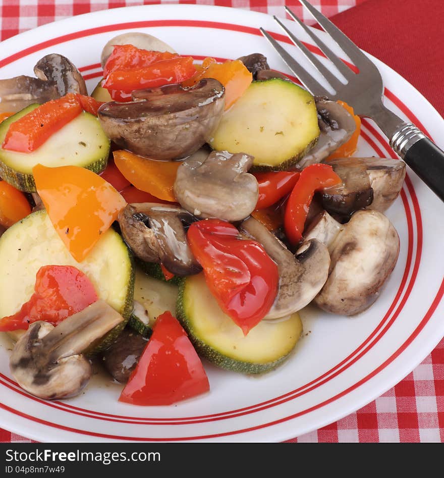 Sauted red and orange peppers, mushrooms and zucchini. Sauted red and orange peppers, mushrooms and zucchini