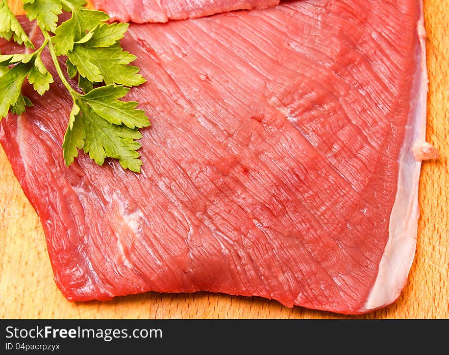 Raw meat slice on board