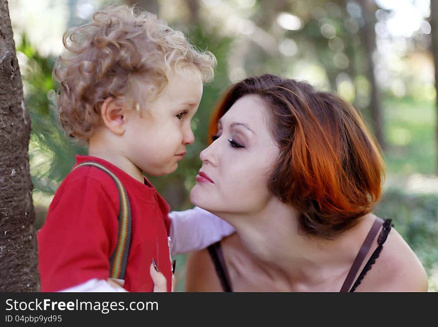 Mother comforts her son for a walk