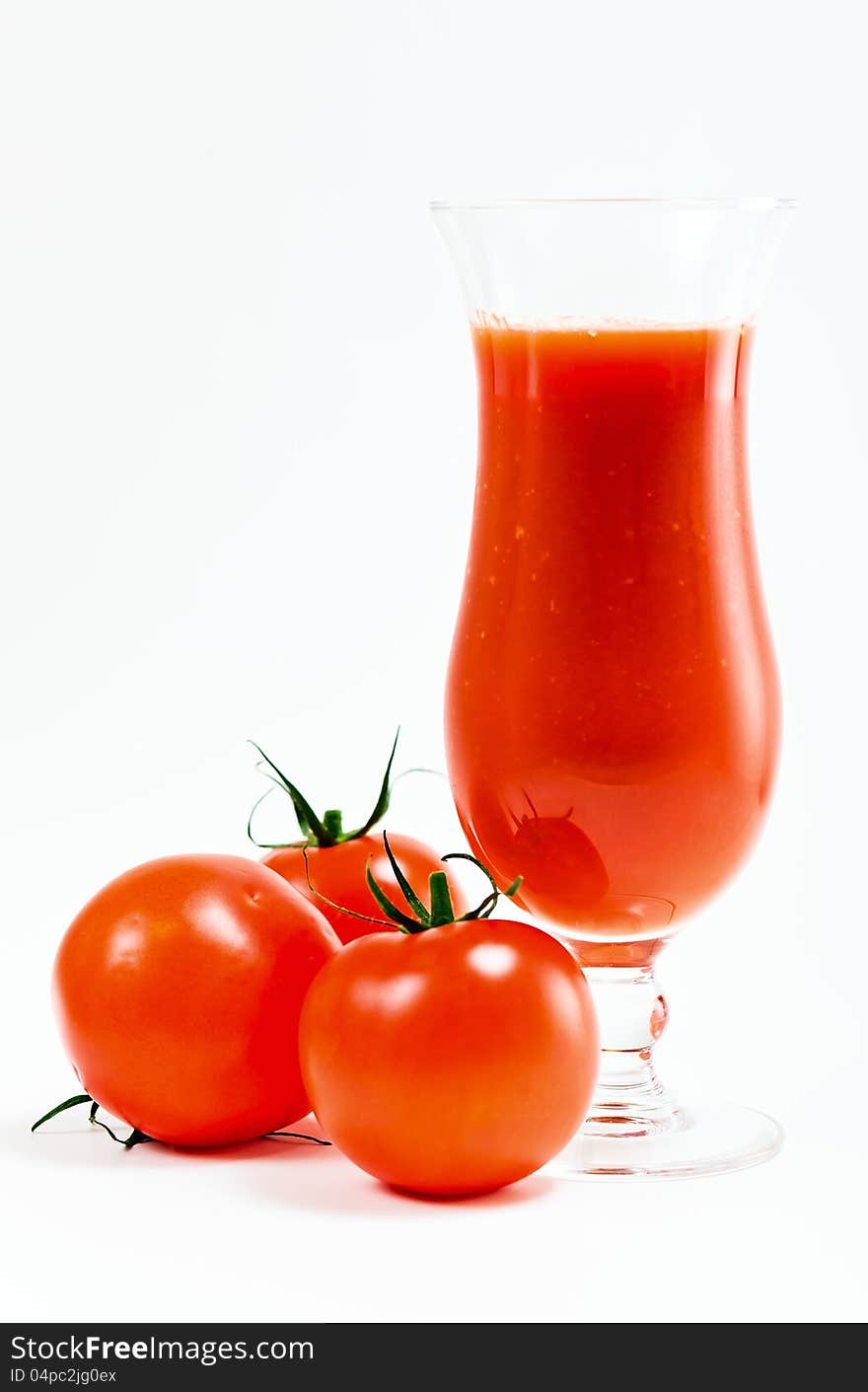 Tomatoes and tomato juice on a white background.