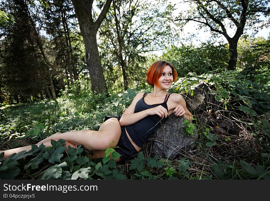 Redhead girl relaxing outdoors