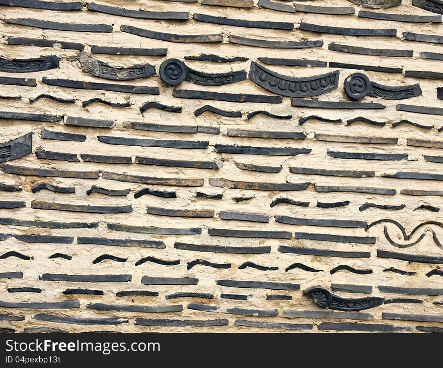 Old brick and Japanese roof tile in the wall. Old brick and Japanese roof tile in the wall