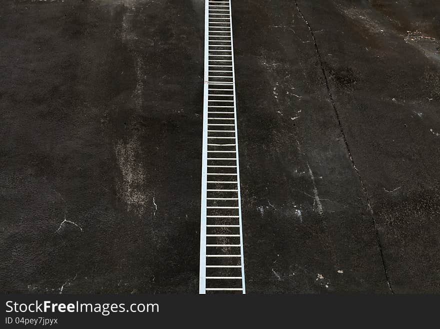 Ladder on a wall to nowhere. Ladder on a wall to nowhere