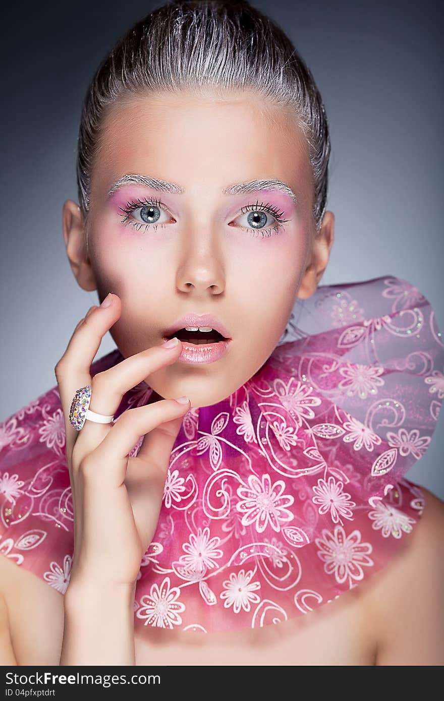 Fashion beauty portrait. girl touching her face - holiday pink make up. Fashion beauty portrait. girl touching her face - holiday pink make up