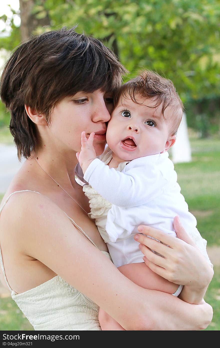 Mother holding her little beautiful daughter. Mother holding her little beautiful daughter