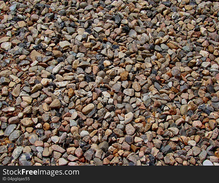 Pebbles on the road - texture or background. Pebbles on the road - texture or background