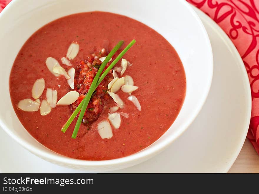 Strawberry gazpacho in a white bowl