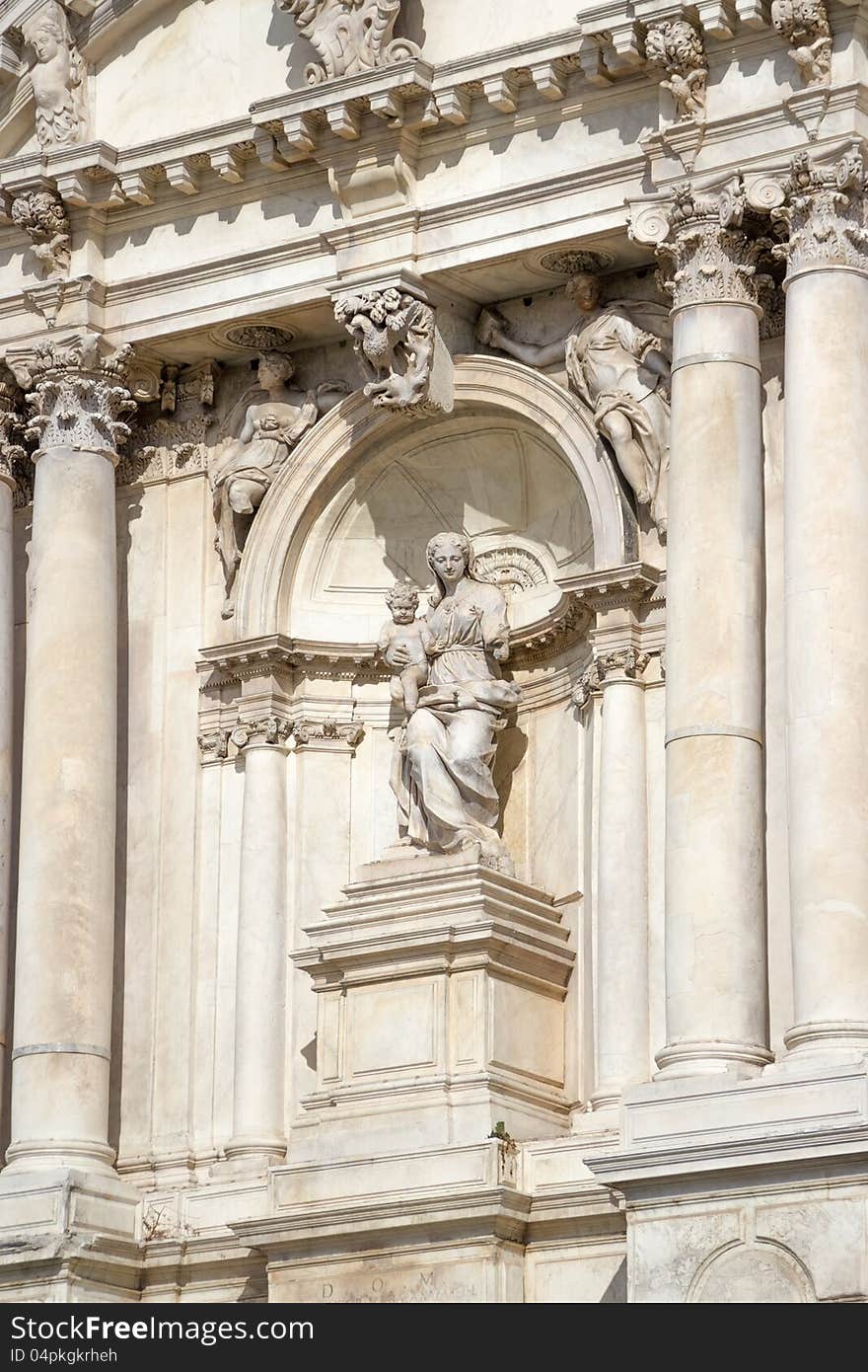 Sculpture of the woman with the child on a facade of an building. Sculpture of the woman with the child on a facade of an building