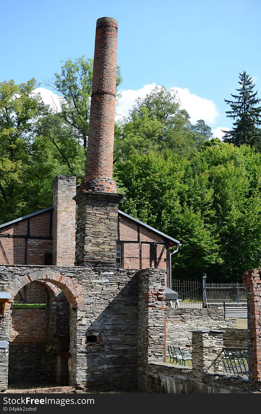 Ruin with chimney of a old iron foundry