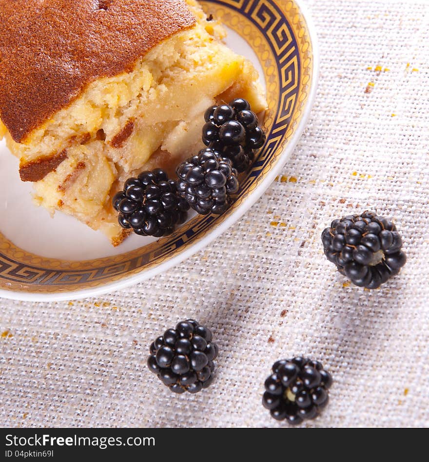 Home made apple pie served with blackberries. Home made apple pie served with blackberries