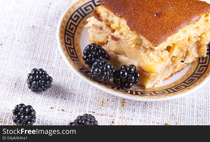 Freshly made apple pie served with blackberries. Freshly made apple pie served with blackberries