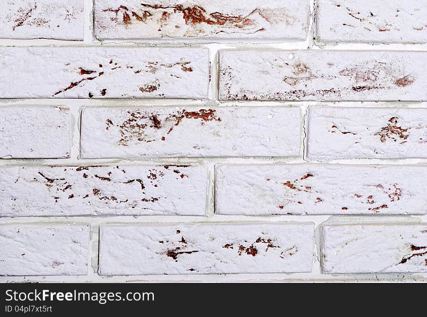 Decorative masonry wall of white brick. Decorative masonry wall of white brick