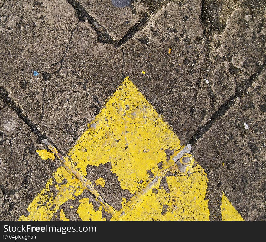 Forwarded yellow arrow on the road. Forwarded yellow arrow on the road