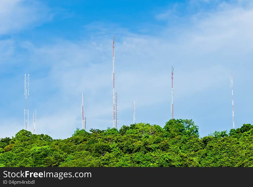 Group of steel communication antenna from tree to cloud blue sky. Group of steel communication antenna from tree to cloud blue sky