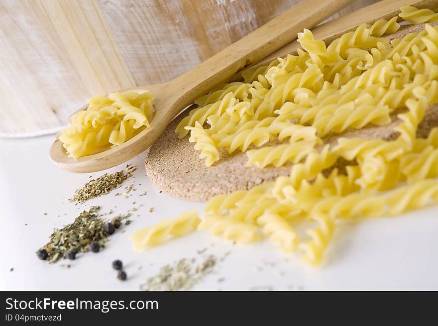 Raw pasta on spoon