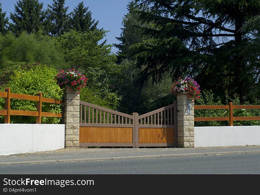 Beautiful wooden gate, entrance to a front yard