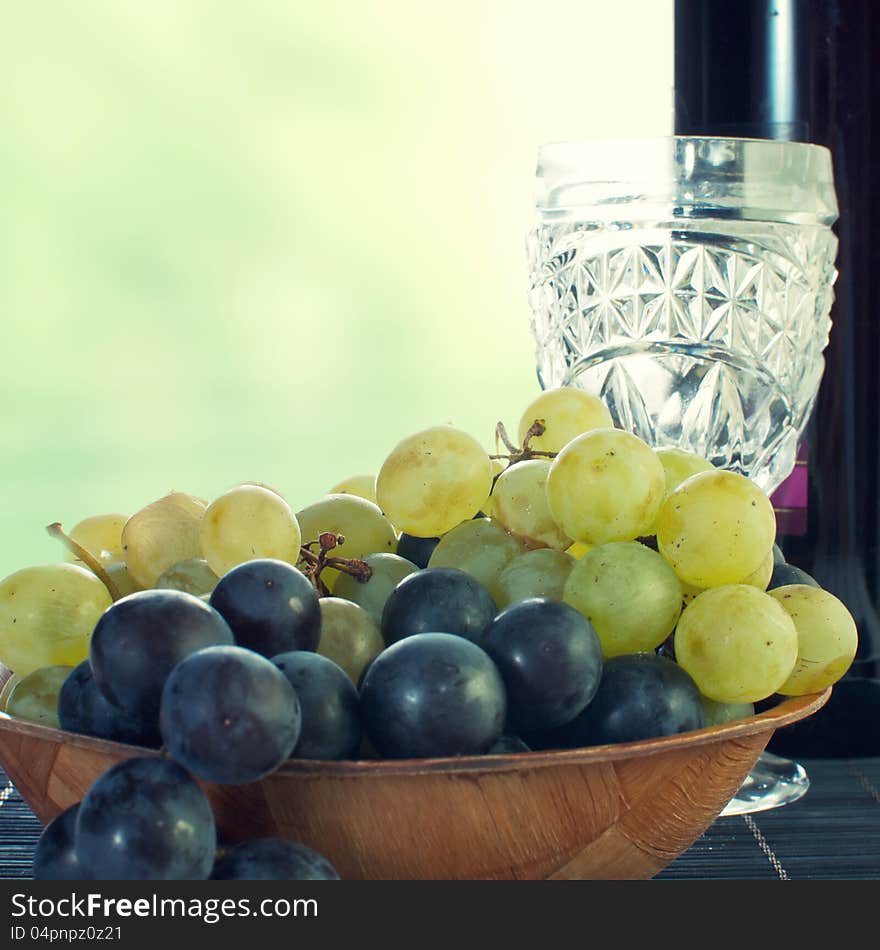 Bottle of wine with grape