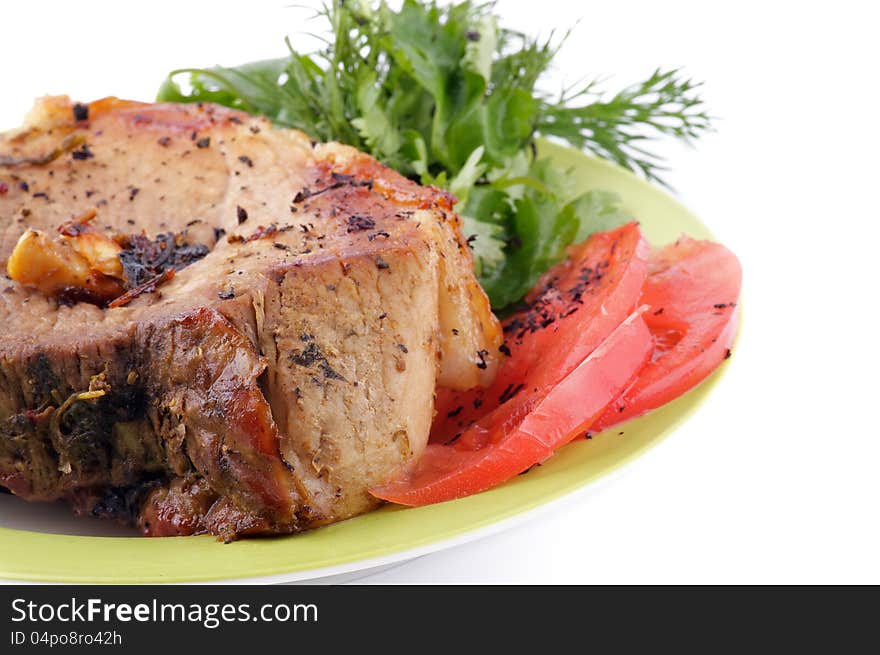 Juicy Pork Chop with Tomatoes and Dill on plate on white background