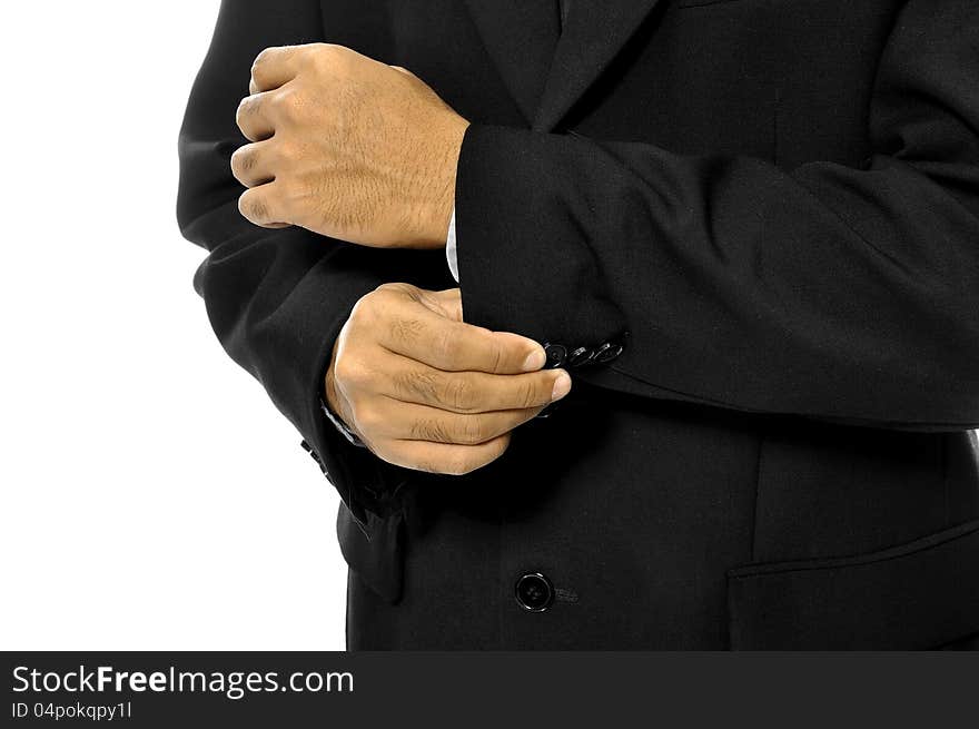 Man buttoning his sleeve isolated over white background