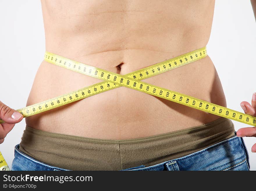 Slim Female Measuring Her Waist