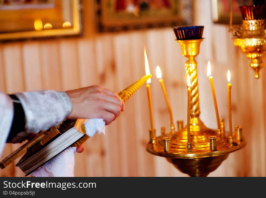 Man hand lighting candles in a church. Man hand lighting candles in a church