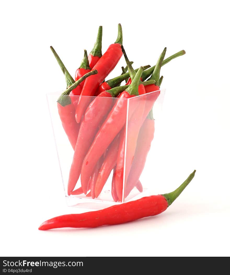 Red chillies on white background