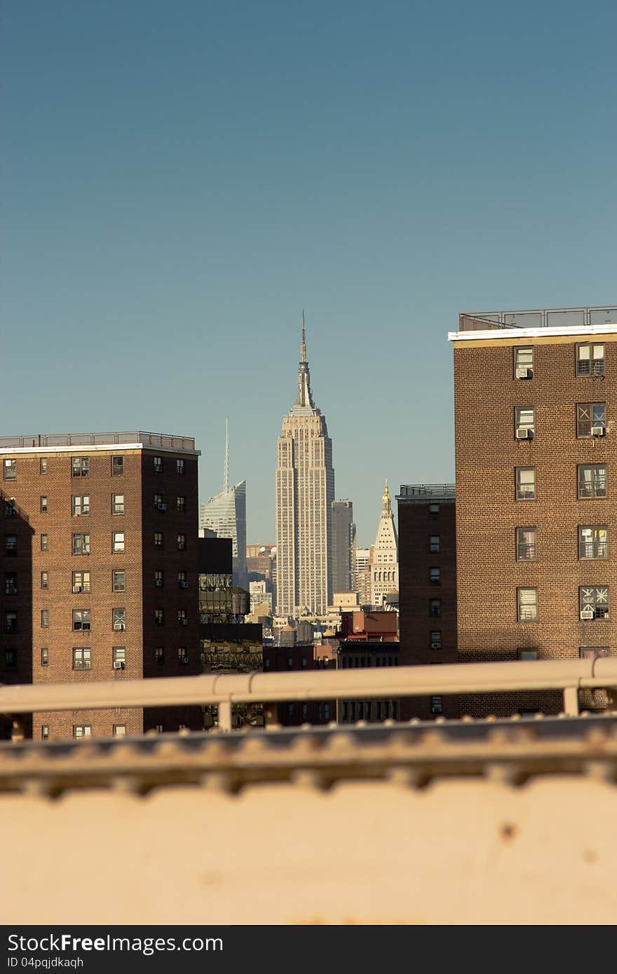 View of the Empire State, Conde Nast and Metropolitan Life buildings from the Brooklyn Bridge, New York. View of the Empire State, Conde Nast and Metropolitan Life buildings from the Brooklyn Bridge, New York