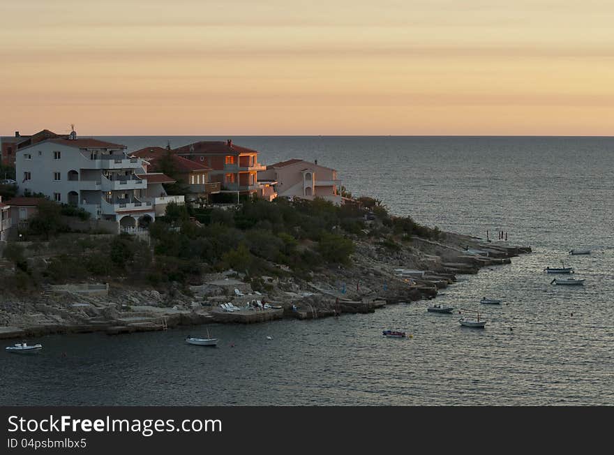 Croatia. Sunset over Adriatic with a view on peninsula with houses. Croatia. Sunset over Adriatic with a view on peninsula with houses