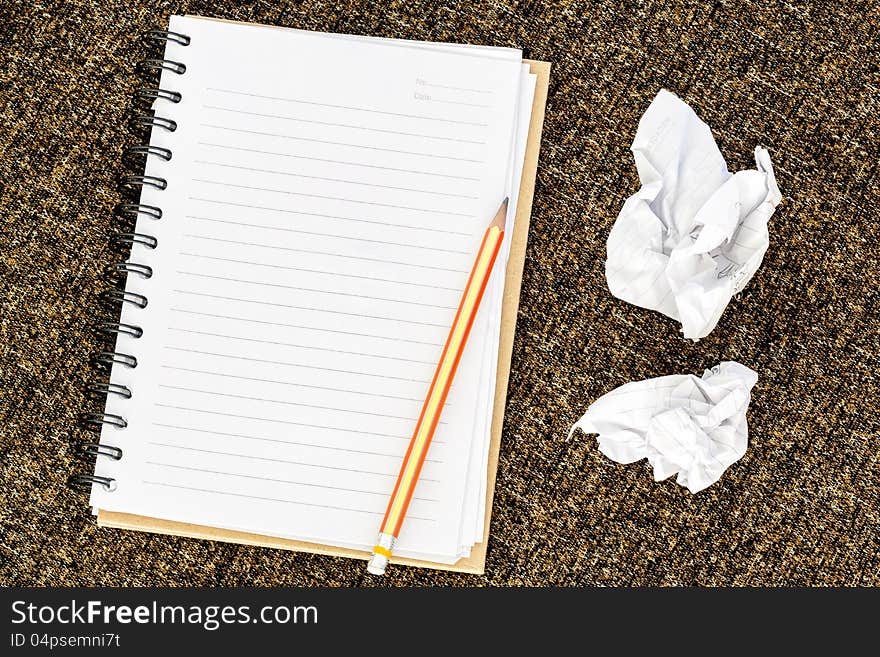 Blank note book with crumpled paper