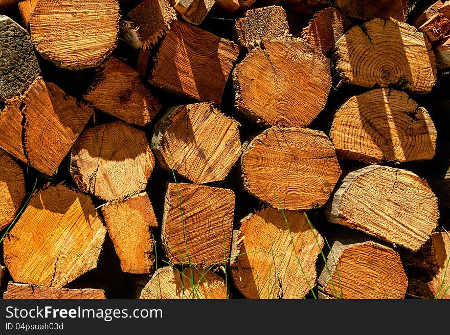 A pile of chopped Firewood background. A pile of chopped Firewood background