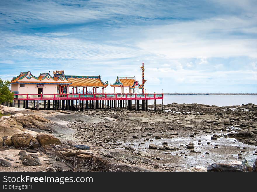 Chinese temple inside the sea and blue sky