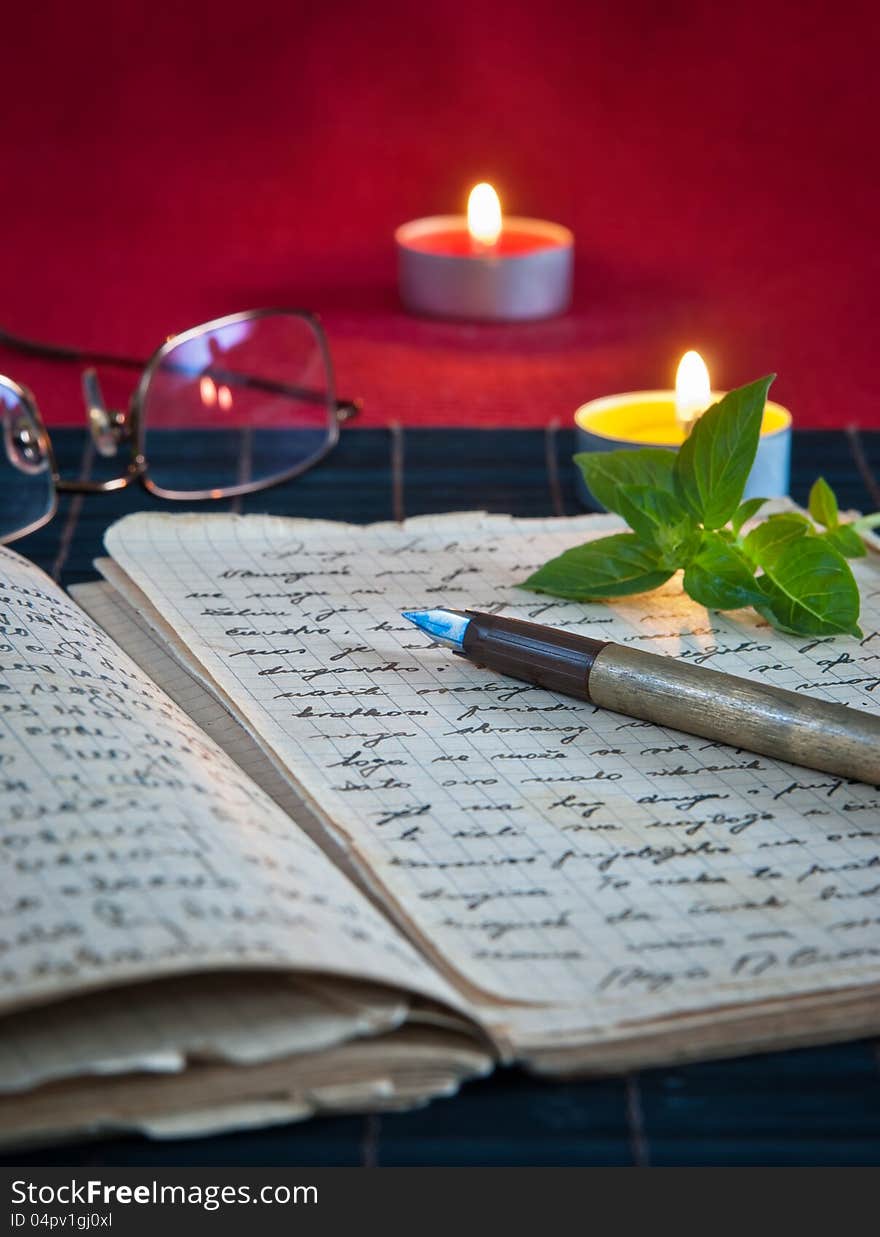 An open old book by the candlelight,close up photo